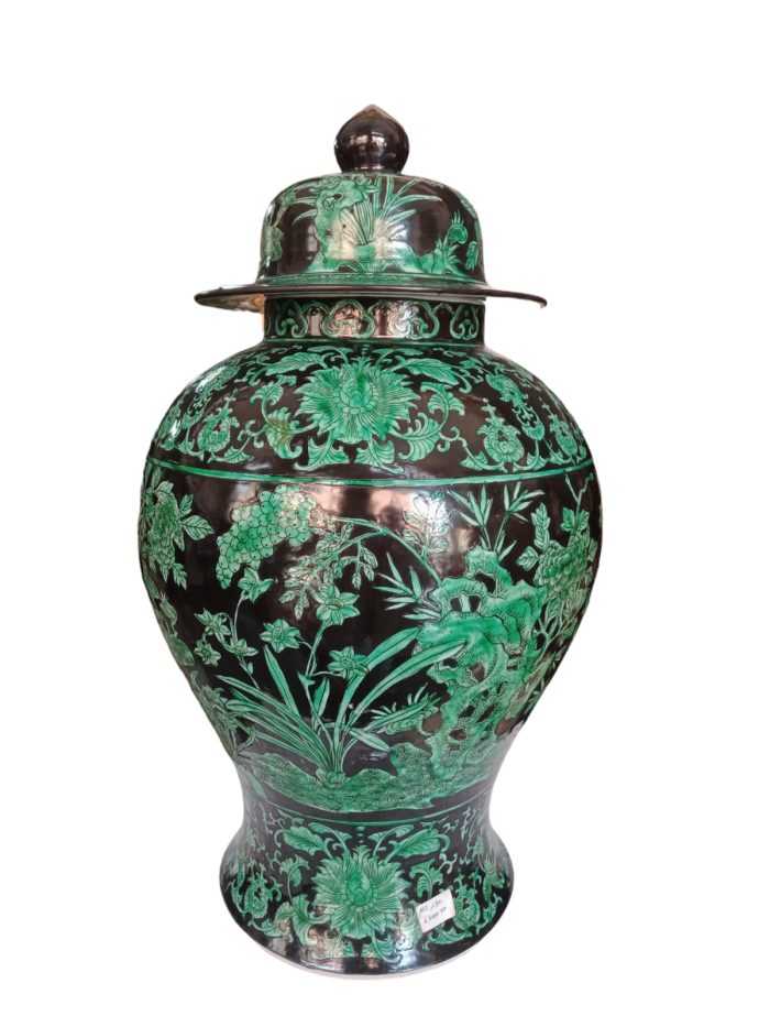 Chinese green and black family vase" likely refers to a specific type of Chinese porcelain vase that features a green and black color scheme.