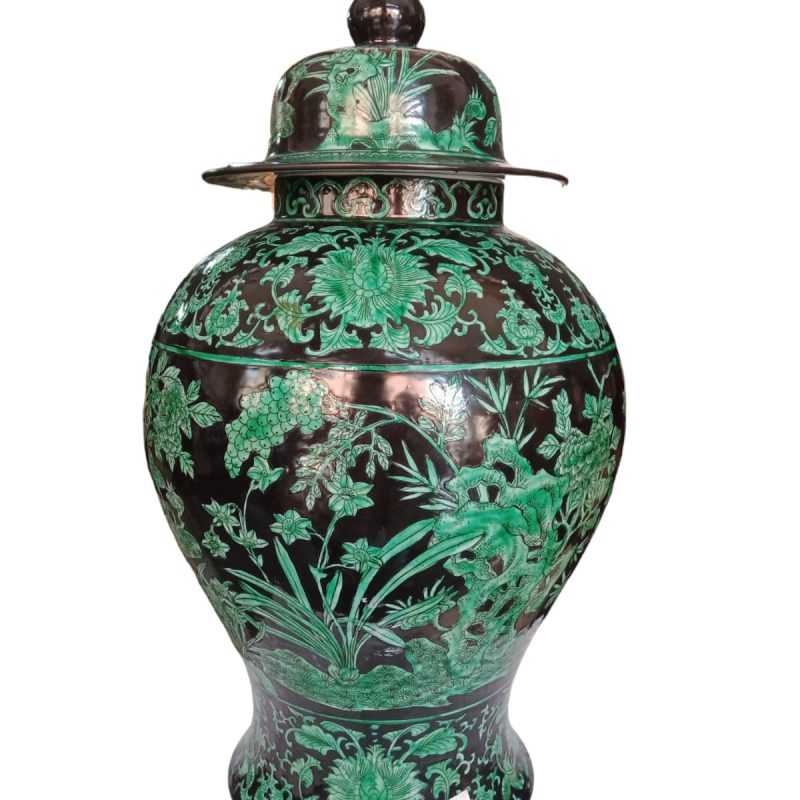 Chinese green and black family vase" likely refers to a specific type of Chinese porcelain vase that features a green and black color scheme.